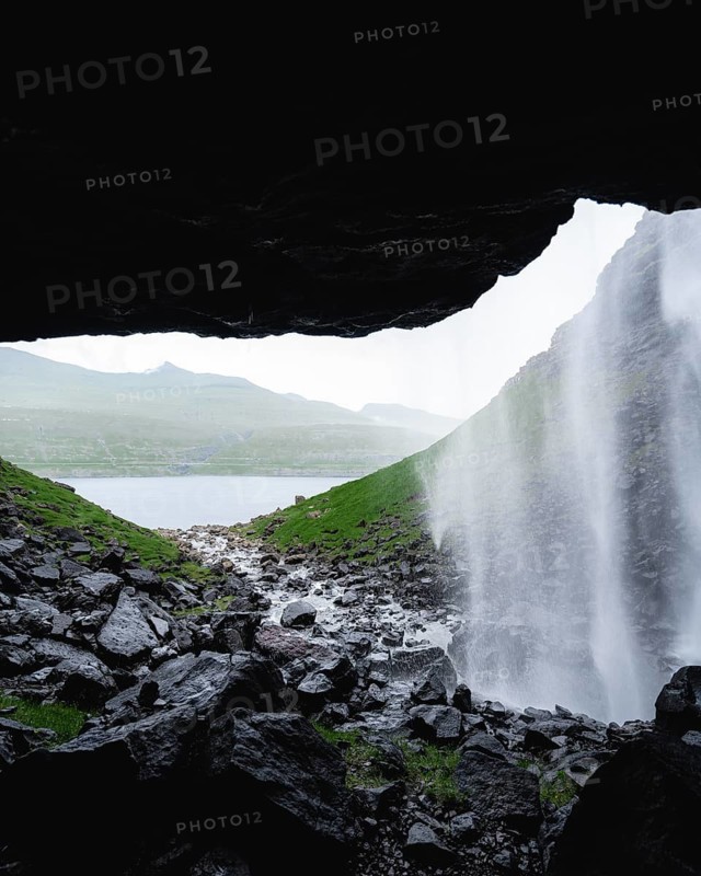 Cave view of Fossa Waterfall, Faroe Islands