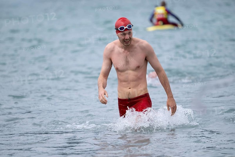 Swimmer comes out of the water after the swimming stage, Tegernsee Triathlon, Tegernsee, Upper Bavaria, Bavaria, Germany