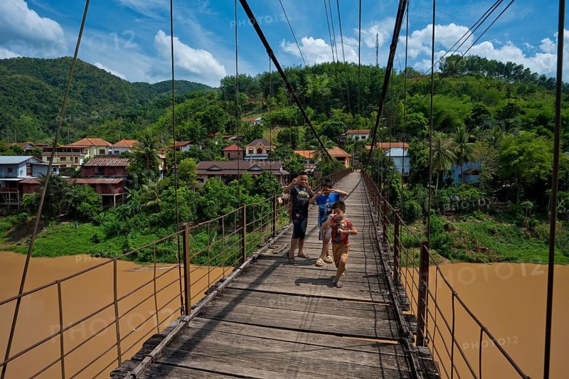 Children on a footbridge over the Nam Phak River which flows into the dammed Nam Ou River in the town of Muang Khua, Phongsali Province. laos