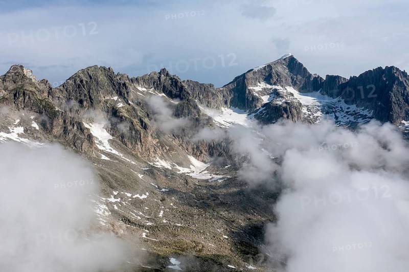 Mountain landscape with clouds of fog, Valais, Switzerland