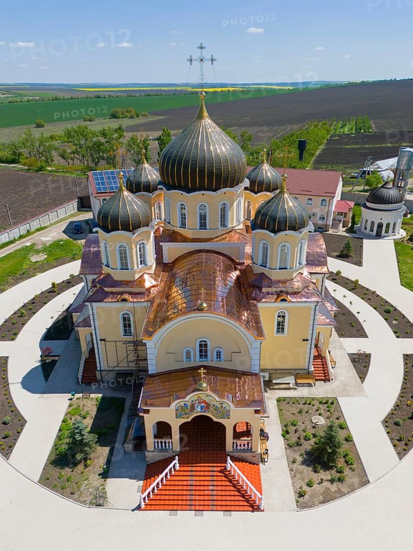 Front view of an orthodox church with symmetrical domes and crosses, rural setting, aerial view, Nicoreni monastery Sf. Ilie, Nicoreni, Drochia, Bessarabia, Republic of Moldova, Moldova
