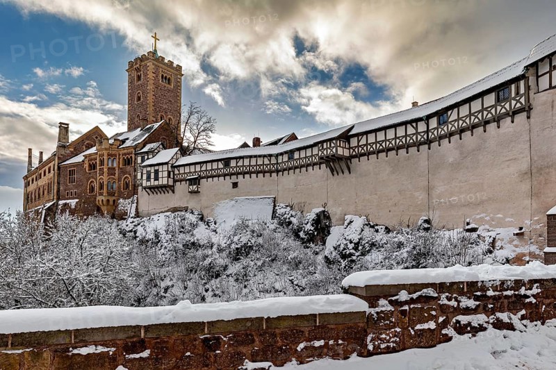 Snowy castle with tower and timbering under sunny sky, The Wartburg near Eisenach in Thuringia