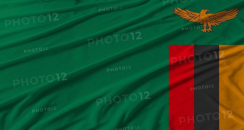 Zambia flag waving. Flag of Zambia with cloth texture