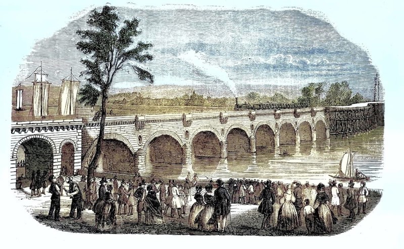 Viaduct of Vierzon, Pont de Vierzon, in the French city of Orléans, 1847, France. Long brick arched bridge crossing the Loire in Orléans, a large crowd has gathered on the promenades and quays of Orléans to marvel at the steaming locomotive on the crossing, illustration, reproduction from a 19th-century model. Authentic, file restored for optimal use, exact date of original unknown, historical, nostalgically colored