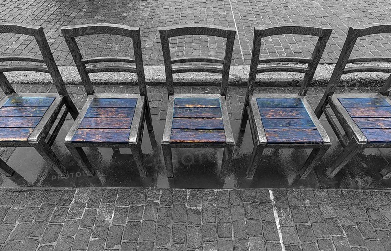 The sixty chairs memorial on the grounds of the Jewish ghetto, black and white, Krakow, Poland
