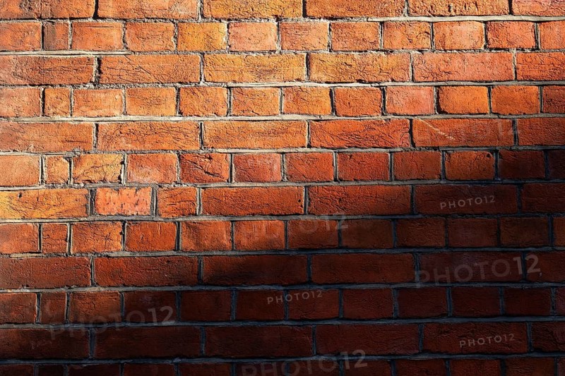 Brick wall made of brown-red, partly shaded bricks, Chelsea, London, England, Great Britain