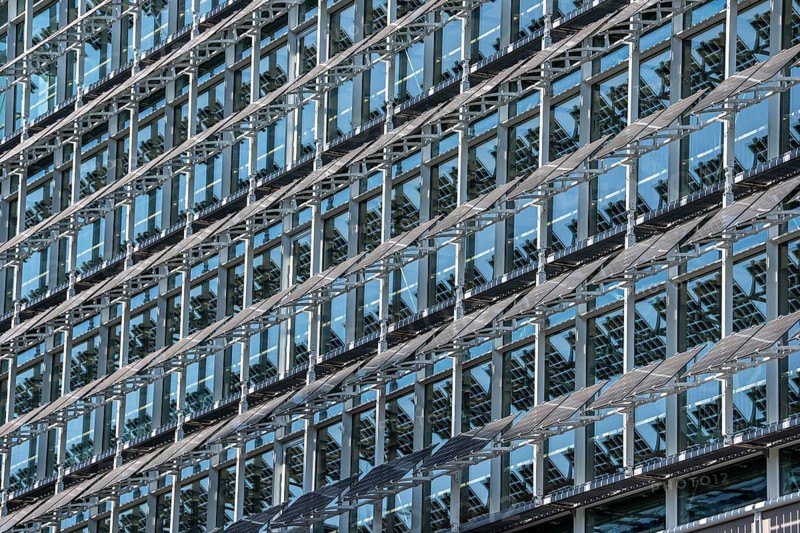 The FLOAT office building in Düsseldorf's media harbor, on Holzstraße, almost 200 meters long façade with movable photovoltaic slats, which on the one hand produce electricity and serve as sun protection for the building, and act as a design element, North Rhine-Westphalia, Germany