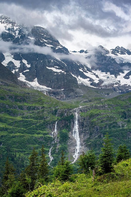 Picturesque mountain landscape with Schmadribachfall waterfall, Breithorn mountain summit, Bernese Alps, Bernese Oberland, Switzerland