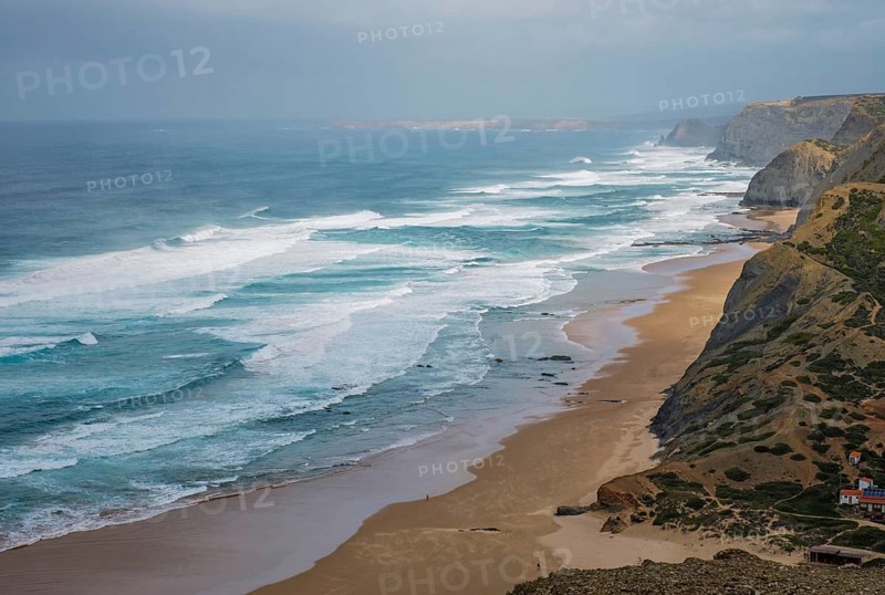 View from Castelejo Viewpoint over Praia do Castelejo in Vila do Bispo, Algarve, Portugal, with Atlantic ocean, cliffs, beach, and surf