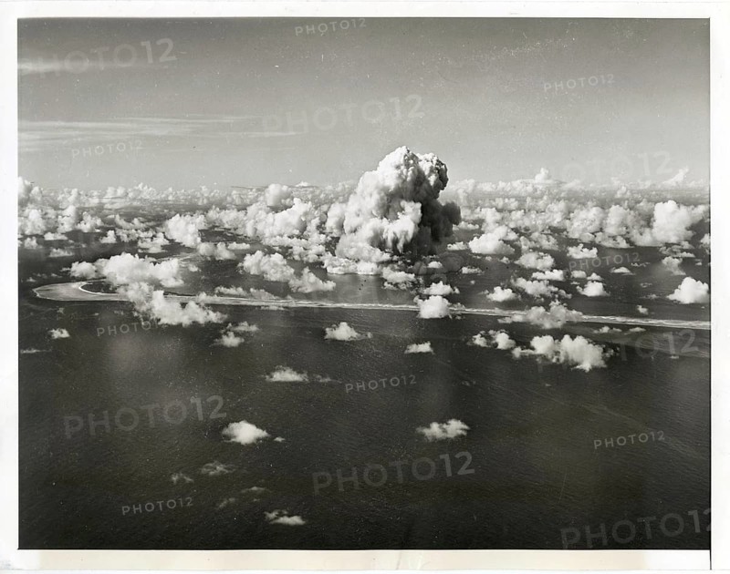 Atomic bomb test, USA, Bikini Atoll, explosion, destruction, paradise, aerial view, landscape with cloud formations over the sea in a dramatic scene, around 1953