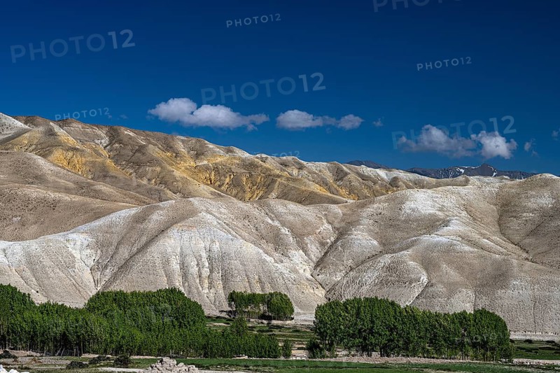 Urban, cultivated valley in front of mountain landscape, erosion landscape near Lo Manthang, Mustang, Upper Mustang, former kingdom, Himalayas, Nepal