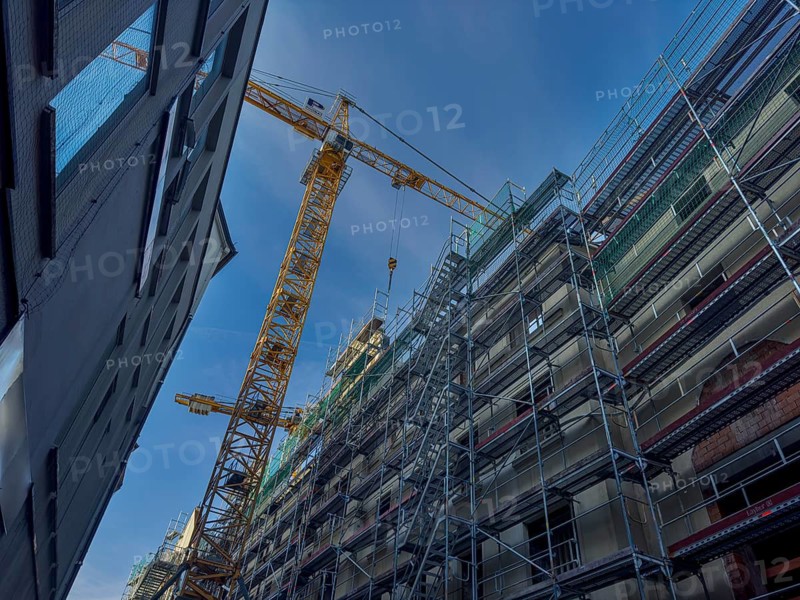 Scaffolding, equipped house, yellow crane, Munich, Bavaria, Germany