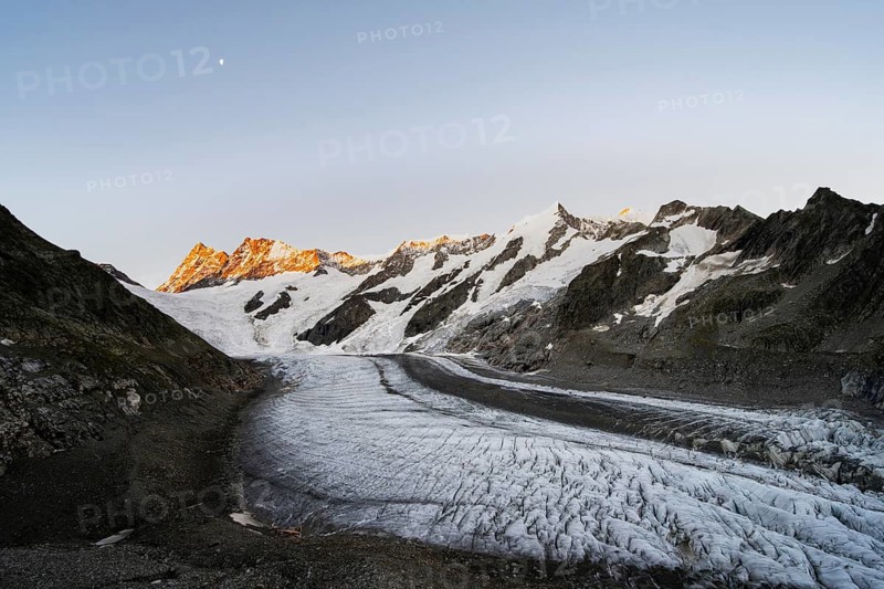 Impressive high-alpine landscape, Finsteraarhorn and Agassizhorn mountain peaks with alpine glow at sunrise, Upper Arctic Ocean glacier, Bernese Alps, Bernese Oberland, Switzerland