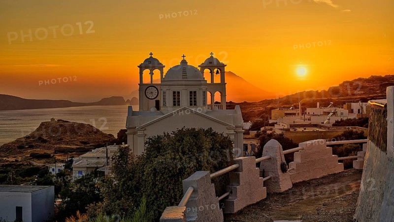 Church, orthodox, Greek Orthodox church, Agios Nikolaos church, a church appears against an orange sunset with sea view and mountains, Trypiti, Tripiti, village, Milos, island, Cyclades, Greek islands, Greece