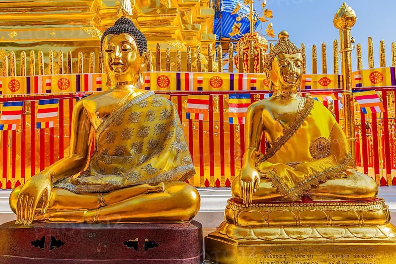 Gilded seated Buddha figures with orange cloaks, Wat Phra That Doi Suthep temple complex, Chiang Mai, Thailand