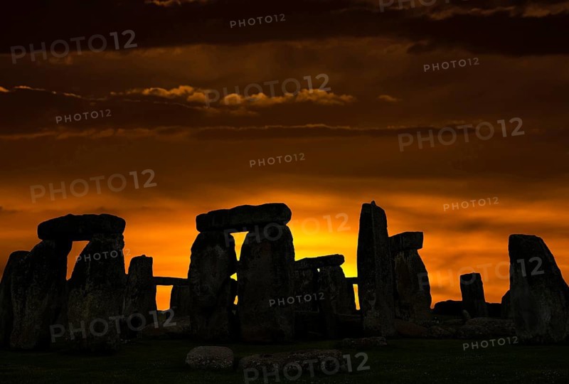 Stonehenge around 3000 BC, a megalithic structure from the Neolithic period, as a silhouette at sunset, Wiltshire, southwest England, England, United Kingdom