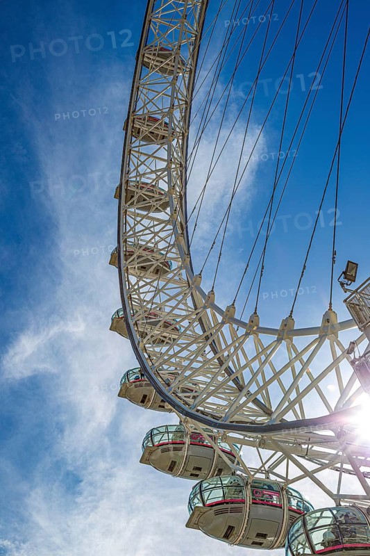 Close-up view of the London Eye capsules and steel structure in bright backlight