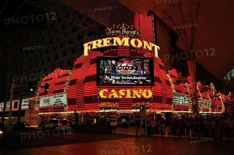 Neon-lit Fremont casino at night dominated by red lights, Las Vegas, Nevada, USA
