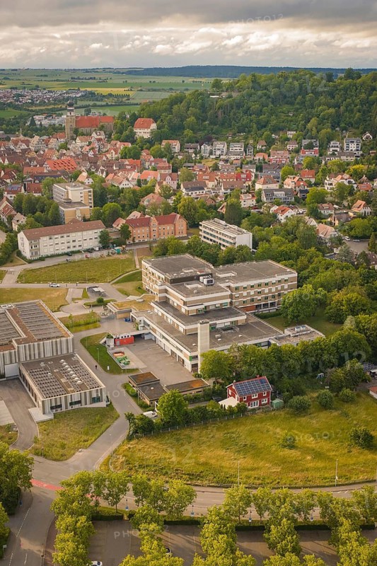 Aerial view of an urban landscape with a view of a large building and surrounding houses, new IGZ, Herrenberg Integrated Health Center, former Herrenberg Hospital, Böblingen district, Germany