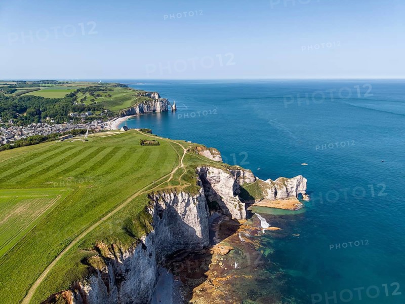 Aerial view of the Falaise d'Amont rock formation with the Porte d'Amont rock gate at low tide, on the horizon the Porte d'Aval rock formation, Étretat, Alabaster Coast, La Côte d'Albâtre, chalk cliffs, English Channel, Seine-Maritime, Normandy, France