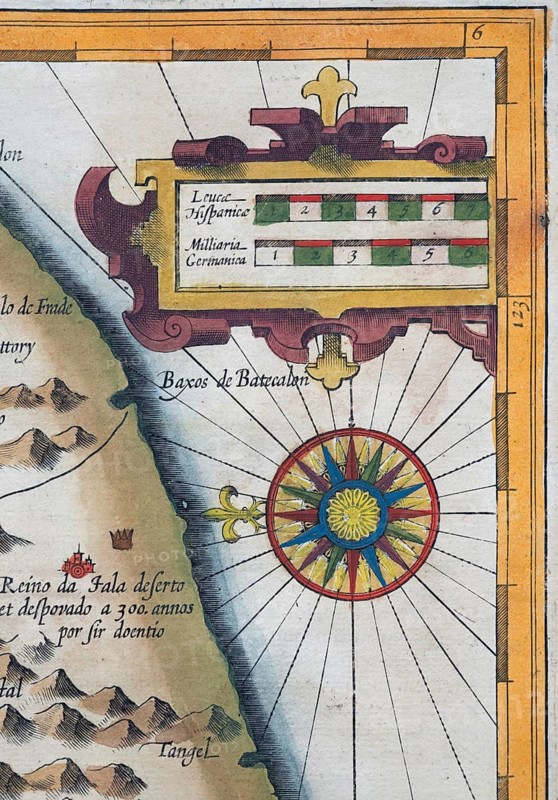 Old coloured map of Ceylon or Sri Lanka decorated with compass rose and decorative cartouche, by Jodocus Hondius from the Mercator Hondius Atlas, Amsterdam, 1633