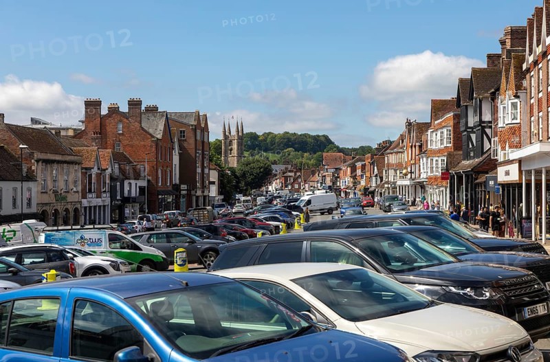 High Street congested with traffic, parked cars, vehicles, Marlborough, Wiltshire, England, UK