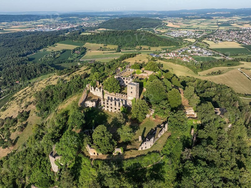 Aerial view of the Hohentwiel volcanic cone with Germany's largest fortress ruin, in the morning sun, a tourist attraction in the Lake Constance region, Hegau, Konstanz district, Baden-Württemberg, Germany