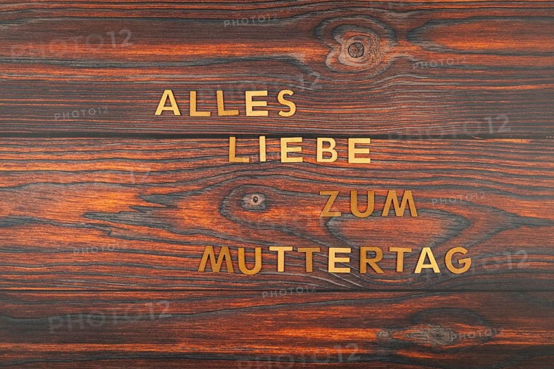 Letters on wooden surface with 'Happy Mother's Day' rustic style