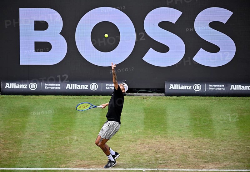 Nick Kyrgios (AUS) serving, with a Boss logo on the backboard in the background, BOSS Open 2026, ATP 250 tennis, grass-court tournament, Stuttgart, Baden-Württemberg, Germany