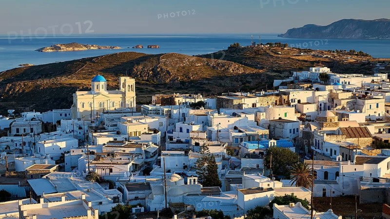 Church, Panagia Odigitria, traditional Greek architecture with a church and white houses on an island at sunset, main town on Kimolos, Kimolos, Chorio, Kimolos island, neighboring island of Milos, Cyclades, Greek islands, Greece