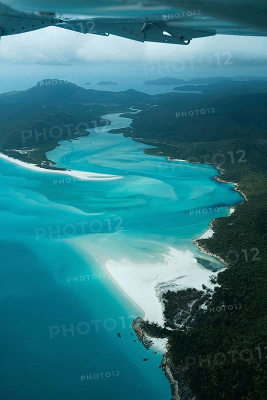 Aerial view of Whitsunday Island beach with aircraft wing, Airlie Beach, Queensland, Australia
