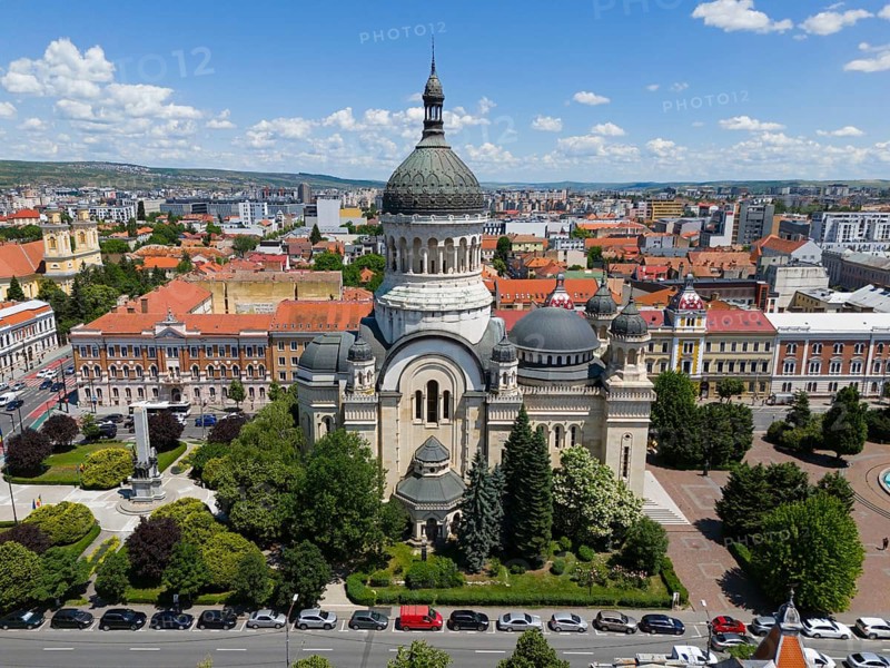 Large church with eye-catching tiled roof nestled in an urban environment with green spaces, aerial view, Metropolitan Cathedral of the Assumption of Mary, Cluj-Napoca, Cluj, Transylvania, Transylvania region, Romania