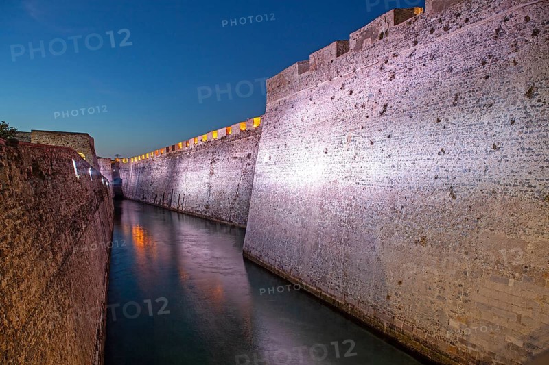 Lights illuminate the Royal moat in the Royal Walls ensemble, Ceuta, Spain, North Africa