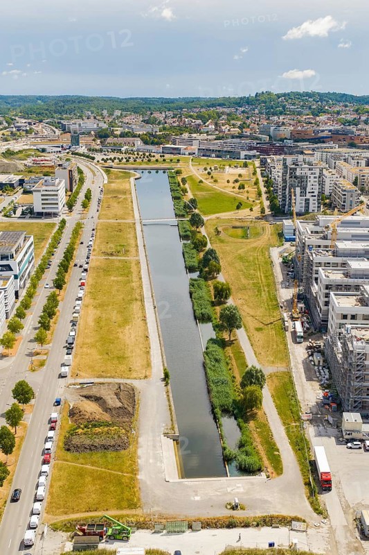A water channel with surrounding urban development and green spaces from a bird's eye view, Flugfeld, Böblingen, Germany