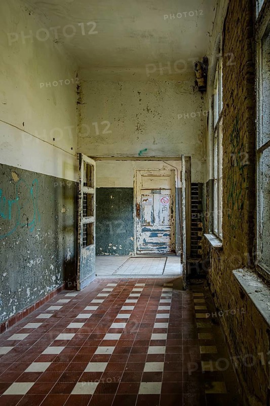 Long dilapidated corridor in the former lung sanatorium and lost place health resort Grabowsee, Oranienburg, Brandenburg, Germany