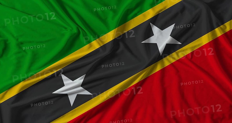 Saint Kitts and Nevis flag with fabric texture background. National flag of Saint Kitts and Nevis with cloth texture