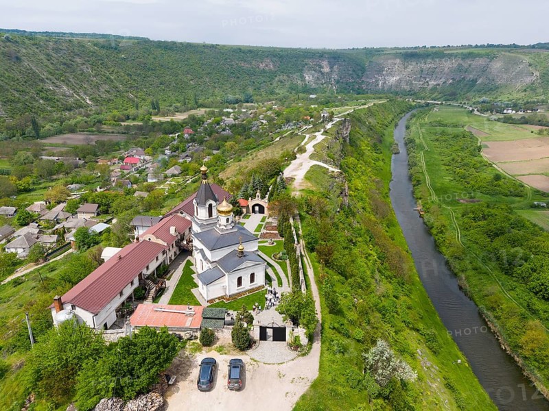 Aerial view of a church overlooking a gorge and a river in a green landscape, aerial view, St. Mary's Church, Butuceni, Old Orhei, Orheiul Vechi, Raut River, Raut, archaeological site, historical-landscape reserve, Orhei district, Republic of Moldova, Moldova