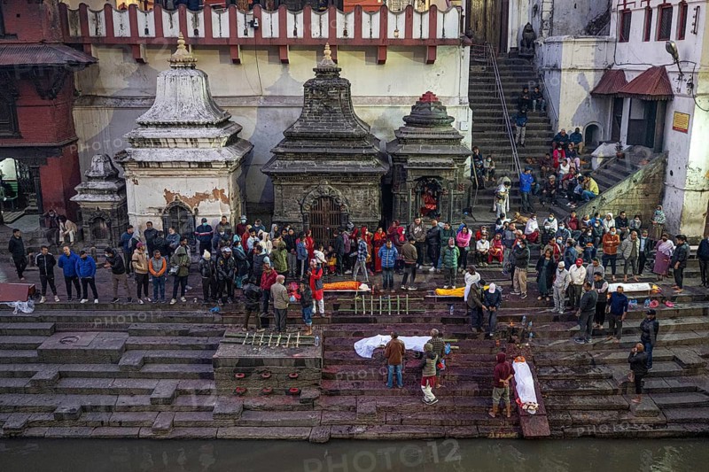 Laying out the dead in front of the cremation ceremony at the Bagmati River Ghat in the Pashupatinath temple district, Hindu holy pilgrimage site, Kathmandu, Nepal