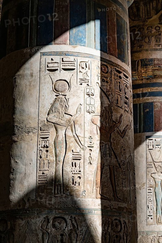 Close up details of the reliefs and hieroglyphs inside Medinat Habu, the ancient Egyptian Mortuary Temple of Ramesses III on the West Bank of The Nile, Luxor, Egypt