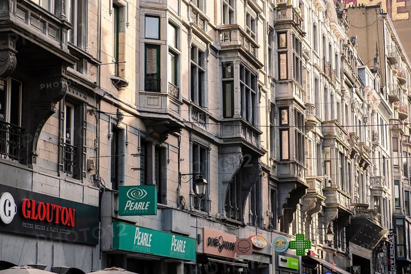 Shopping street with old houses from the Wilhelminian period in downtown Liège, Belgium