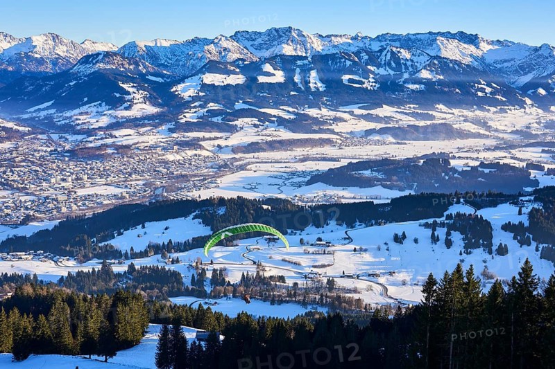 Panorama of the Allgaeu High Alps above Valley of river Iller with paraglider, Sonthofen, Bavaria, Germany