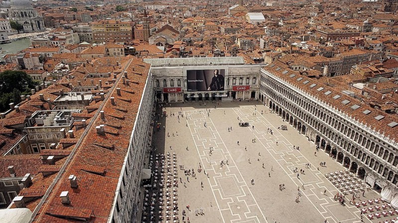 View from above of St. Mark's Square and the rooftops of Venice, Historic Square full of people surrounded by impressive architecture, Venice, Veneto, Italy