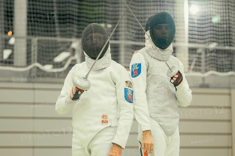 Two fencers in white equipment standing side by side, one lifting a sword, fencing, TSV Calw, Calw district, Germany