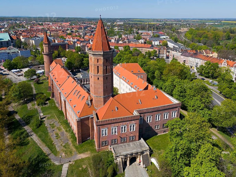 Unique aerial view of a castle with distinctive roofs, located in an urban environment, aerial view, Piast Castle, Legnica, Legnica, Lower Silesian Voivodeship, Poland