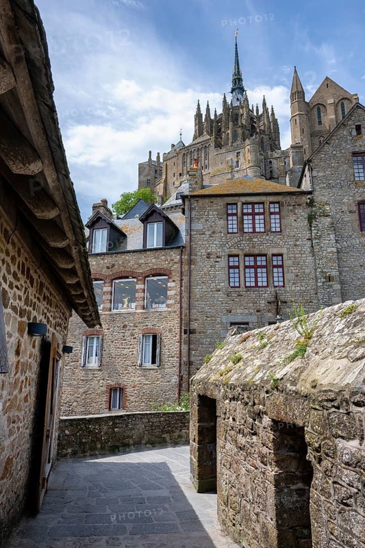 View through a historic alley of Mont-Saint-Michel Abbey, tourist attraction, UNESCO World Heritage Site, Pontorson, Manche department, Normandy, France
