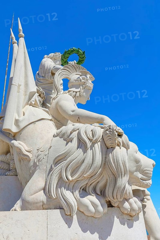 Goddess Minerva statue standing at the top of Rua Augusta Arch, Commerce square, Lisbon, Portugal