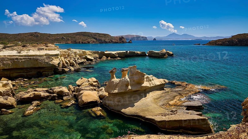 Coastal scene with unique rock formations and crystal clear water under a bright blue sky, Aspragremna, White Cliffs, Mavorspilia Beach, Kimolos Island, Kimolos, Cyclades, Greek Islands, Greece