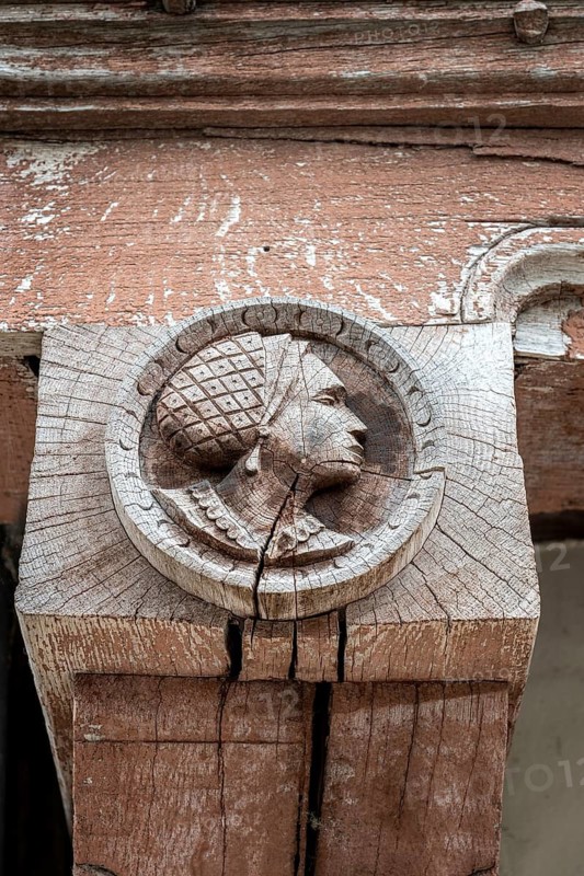 Historic wood relief, profile portrait of a woman on a support beam of a historic half-timbered building in the old town of Troyes, Aube department, Grand Est region, France