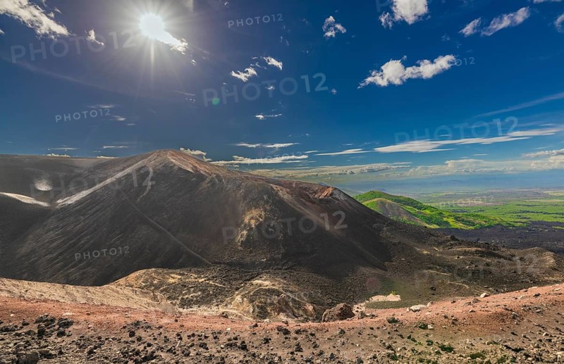 Viewpoint of the Cerro Negro volcano surrounded by vegetation. Scenic view of Cerro Negro, Nicaragua