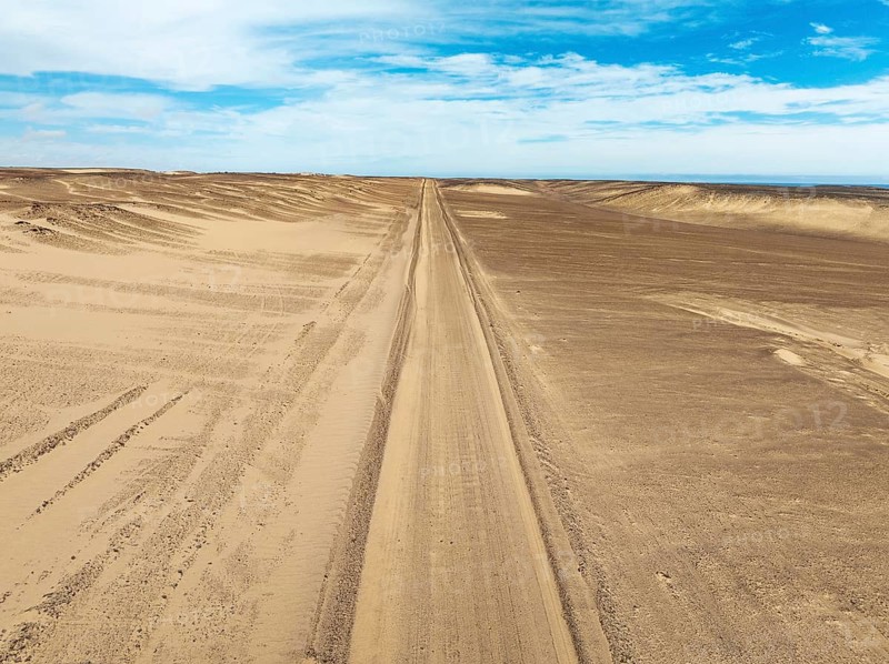 Desert road in the Namib Desert. Aerial view. Drone shot. Skeleton Coast, Namibia
